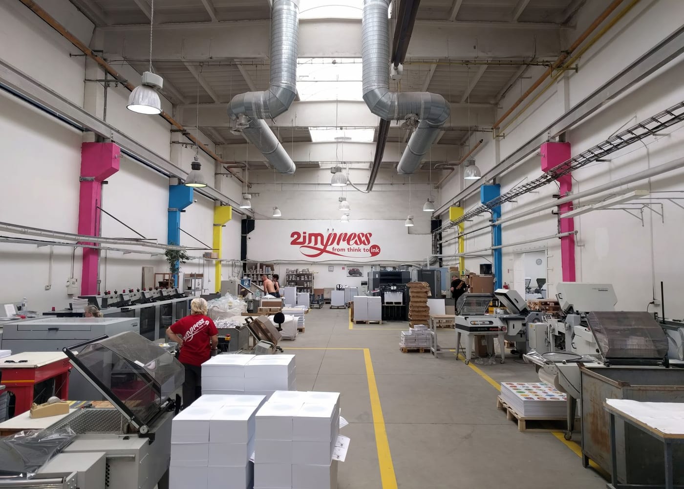 A wide-format printer running inside a print production facility